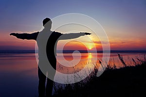 The silhouette of a man at sunset