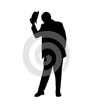 Silhouette of a Man Tipping his Hat photo