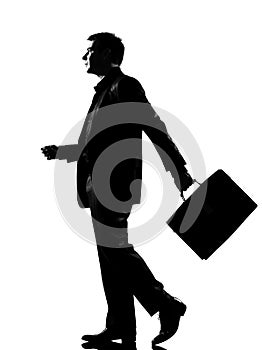 Silhouette man walking profile with briefcase