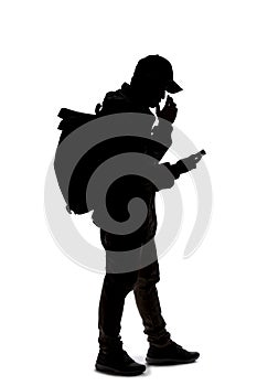 Silhouette of a Man Checking His Cell Phone