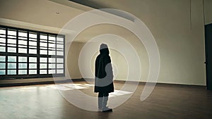 silhouette Man Wearing A Hood In An Empty Room