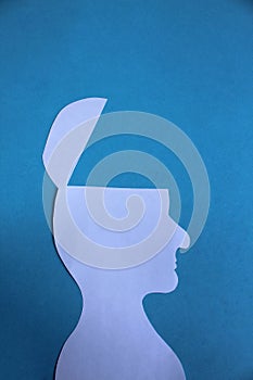 Silhouette of a man of white paper with half the head cut off