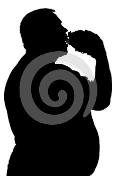 Silhouette of a man who eats unhealthy food