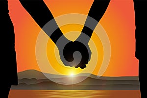 Silhouette of man and woman holding hand at the beach on sunrise background