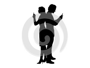 Silhouette man and woman look at the phone