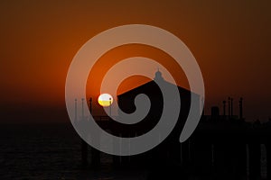 Silhouette of Manhattan beach pier during beautiful sunset in Ca