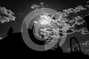 Silhouette of Matadero building and giant ferris wheel in Madrid