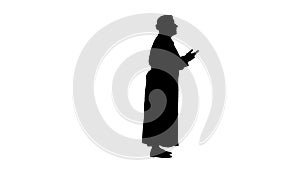 Silhouette Mature female doctor talking to someone.