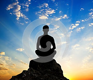 Silhouette of the meditating person