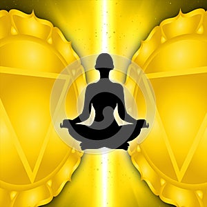 Silhouette of meditating person with solar plexus chakra symbol background