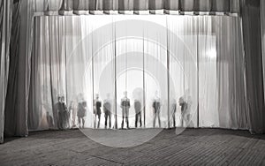 The silhouette of the men behind the curtain in the theater on stage, the shadow behind the scenes is similar to the white and bla