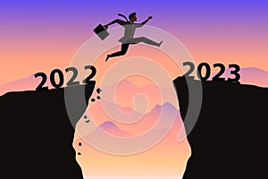 silhouette of men jumping from a cliff over a cliff from 2022 to 2023 with sunlight. Sunset sky. illustration