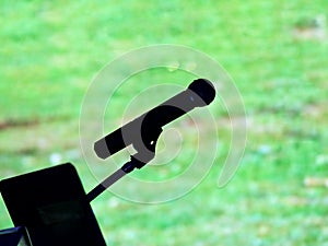 silhouette microphone for talking meeting sing comment on green background