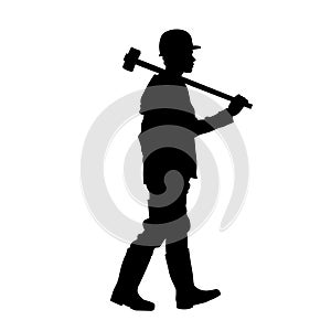 silhouette of a miner worker bringing his sledge hammer.