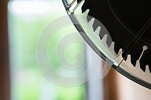 Silhouette of a miter saw blade with plastic safety cover
