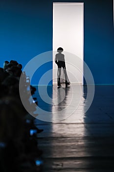 Silhouette of model on catwalk photo