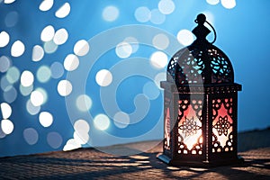 Silhouette of Moroccan lantern with burning candle