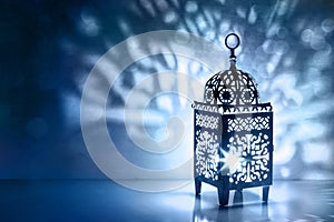 Silhouette of Moroccan lantern with burning glowing candle. Decorative shadows. Festive greeting card, invitation for