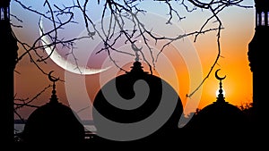 The silhouette of the mosque against the background of sunset sky.