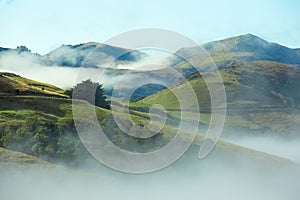 Silhouette of mountains in the misty morning. View of the mountains in early winter. Beautiful nature landscape. Bank Peninsula,