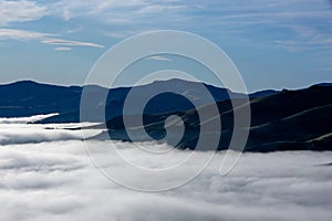 Silhouette of mountains in the misty morning. View of the mountains in early winter. Beautiful nature landscape. Bank Peninsula,