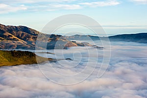 Silhouette of mountains in the misty morning. View of the mountains in early winter. Beautiful nature landscape. Bank Peninsula,