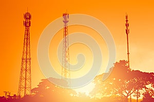 Silhouette multiple band telephone cell site towers