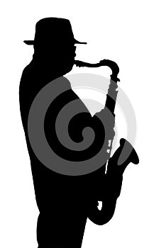 Silhouette of the musician playing on a saxophone.