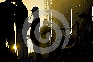 Silhouette of musicians at the stage