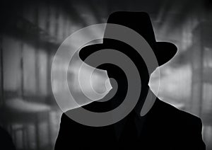 Silhouette of a mysterious man in a hat