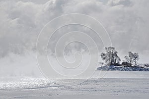 Silhouette of Mystic Point in ice fog Lake Ontario