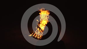 Silhouette of mystic woman in black background of fire fly flame, spark, of contour outline. Outdoor slow motion