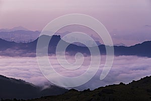 Silhouette of natural landmark Lion Rock in Hong Kong city at dawn