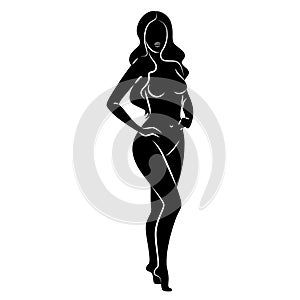 Silhouette of a nice lady, she is standing. The girl has a beautiful naked figure. The woman is a young sexy and slender