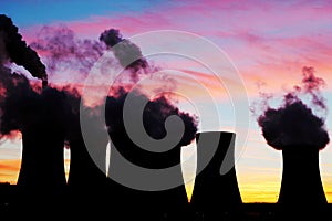 Silhouette of nuclear power plant during sunset