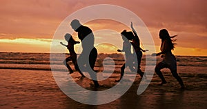 Silhouette, ocean and friends running at sunset for summer vacation, holiday and travel together outdoor. Beach, dusk