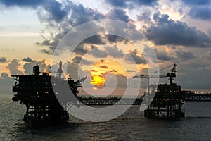 Silhouette of an oil production platform at Terengganu oil field