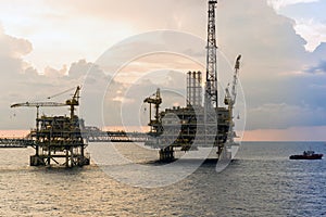 Silhouette of oil production platforms at Terengganu oil field during sunset