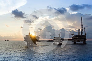 Silhouette of oil production platforms at Terengganu oil field during sunset