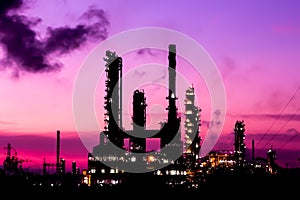 Silhouette oil refinery plant at twilight morning