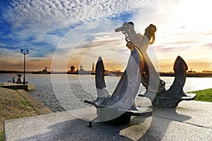 Silhouette of old sea crossed anchors on the background of Peter's harbour. Kronstadt, St. Petersburg, Russia