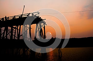 The silhouette of old wooden bridge Bridge (Mon bridge)