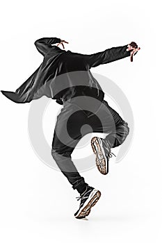 The silhouette of one hip hop male break dancer dancing on white background