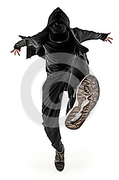 The silhouette of one hip hop male break dancer dancing on white background