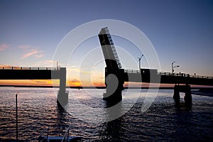 Silhouette of an open drawbridge