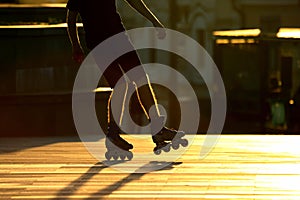 Silhouette pairs of legs on roller skates