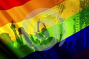 silhouette of a parade of gays and lesbians with a rainbow flag - symbol of love and tolerance