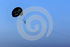 Silhouette parasail wing pulled.