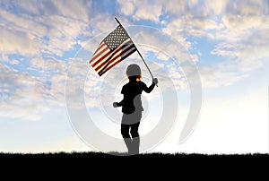 Silhouette of Patriotic Little Girl Child Waving American Flag