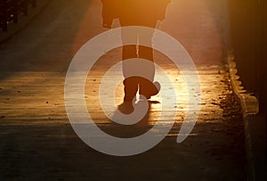 Silhouette of pedestrian on bridge in freiburg